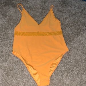 Yellow bodysuit